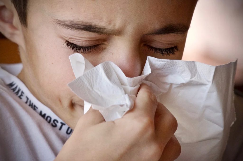 Child blowing his nose