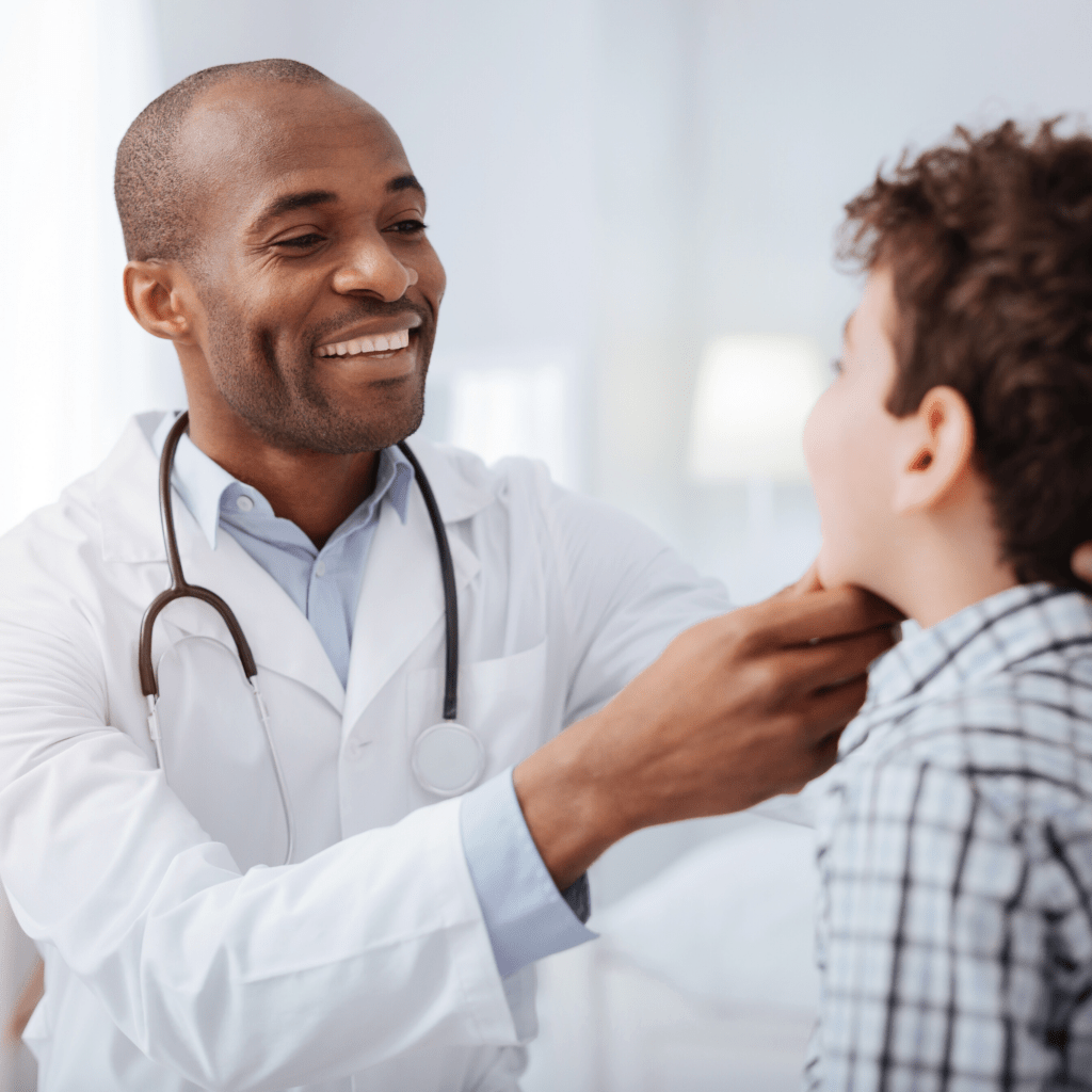 ENT doctor checking out child's throat